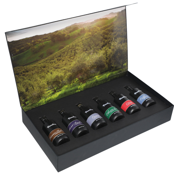 Premium Pasolivo products packaged in beautiful black box with green olive orchard imagery.