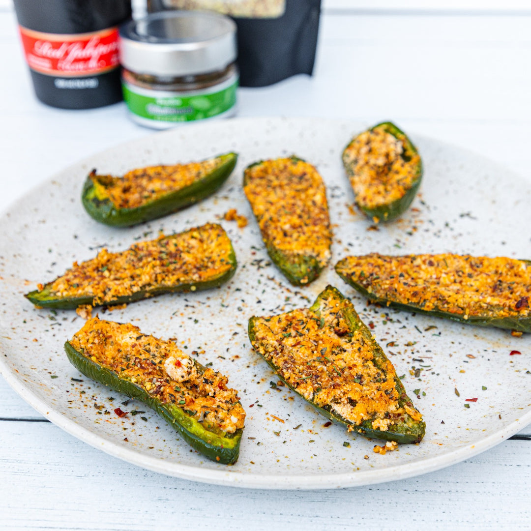 Pasolivo Jalapeño Appetizer Recipe on a table next to Pasolivo Spices and Olive Oil