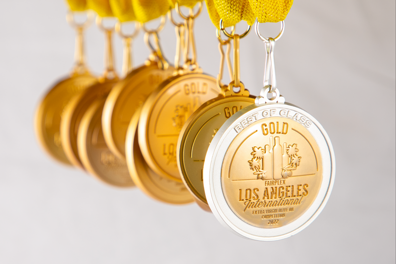 Gold medals with 'Los Angeles International' text on a white background