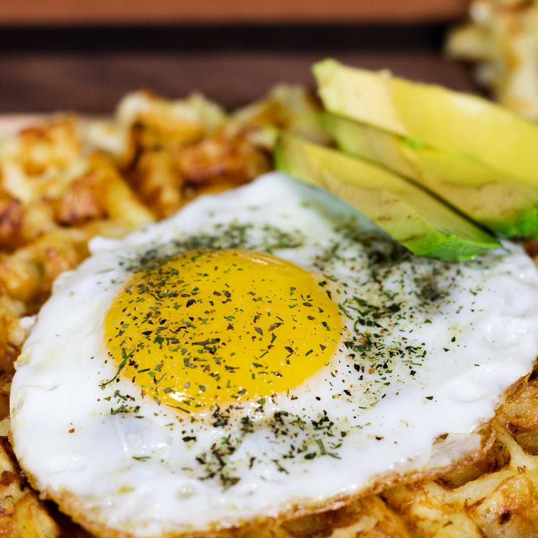 Pasolivo Hashbrown Waffles Recipe garnished with egg and avocado