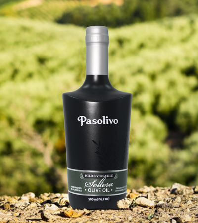 Bottle of Pasolivo Soltera extra virgin olive oil on a natural orchard background